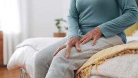 Knee pain, hands and senior woman in home with arthritis, joint ache and osteoporosis in bedroom. Closeup, elderly healthcare and massage legs for fibromyalgia, orthopedic injury or medical problem - Powered by Shutterstock - Get 15% off with code: PIKWIZARD15