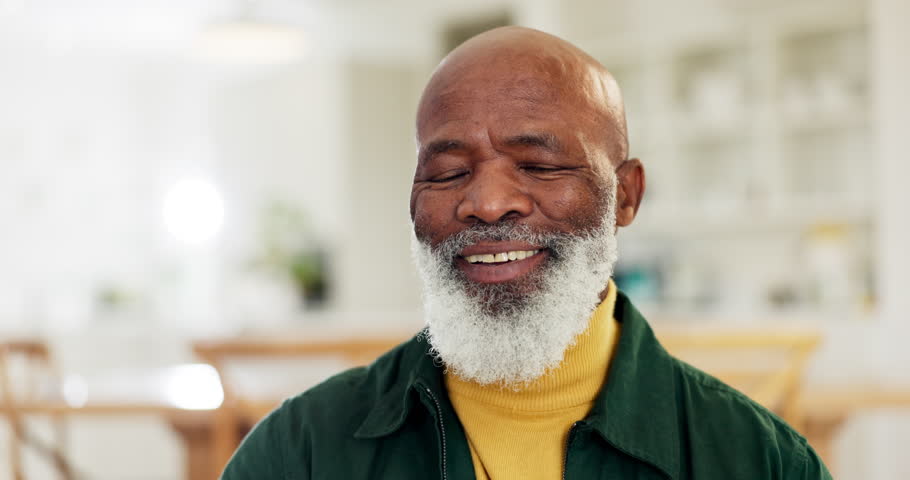 Face, smile and a senior black man in the living room of his retirement home to relax on the weekend. Portrait, funny and a happy elderly person laughing at a joke or joy in his apartment for comedy Royalty-Free Stock Footage #1110916907