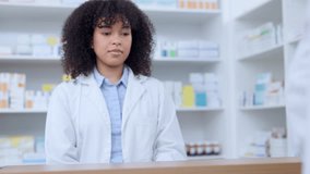 Friendly pharmacists giving prescribed medicine to a customer at a pharmacy. A woman healthcare professional handing a patient their medication at a dispensary. Medical provider passing client pills - Powered by Shutterstock - Get 15% off with code: PIKWIZARD15