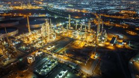 Aerial view of the petrochemical, oil and gas industry. Industrial field, oil refinery storage tanks and steel pipelines at night, ecology and health.	 - Powered by Shutterstock - Get 15% off with code: PIKWIZARD15