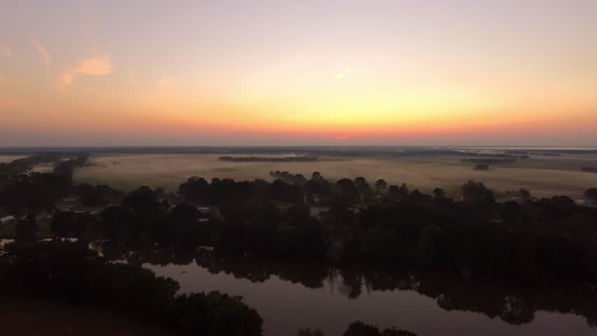 Aerial Growth Of Trees On Landscape, Drone Flying Backwards During Sunset - Bayou, Louisiana
