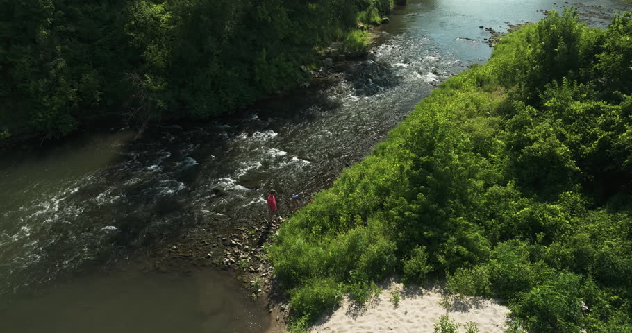 Aerial View Over River Flowing Through The Forest In Oronoco, Minnesota, USA - drone shot