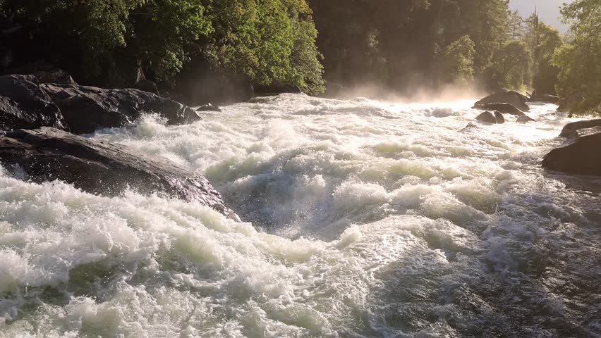 River Rapids in the Merced River as it runs through Yosemite National Park in California. Slow Motion. This video Loops seamlessly. Royalty-Free Stock Footage #1110932975
