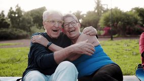 Happy senior couple having fun smiling in city nature. Older people enjoy together. Elderly and healthy life style - Powered by Shutterstock - Get 15% off with code: PIKWIZARD15