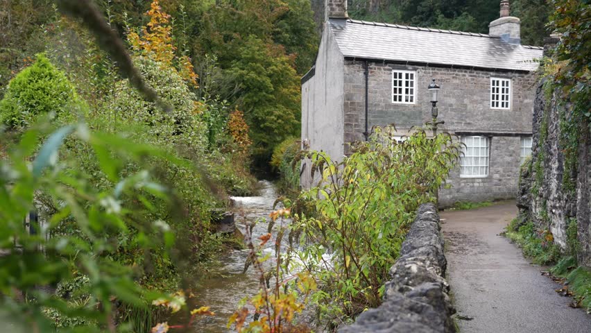 Cute old cottage in Castleton, Peak District. Small village in rural England, in gloomy Autumn weather Royalty-Free Stock Footage #1110941245