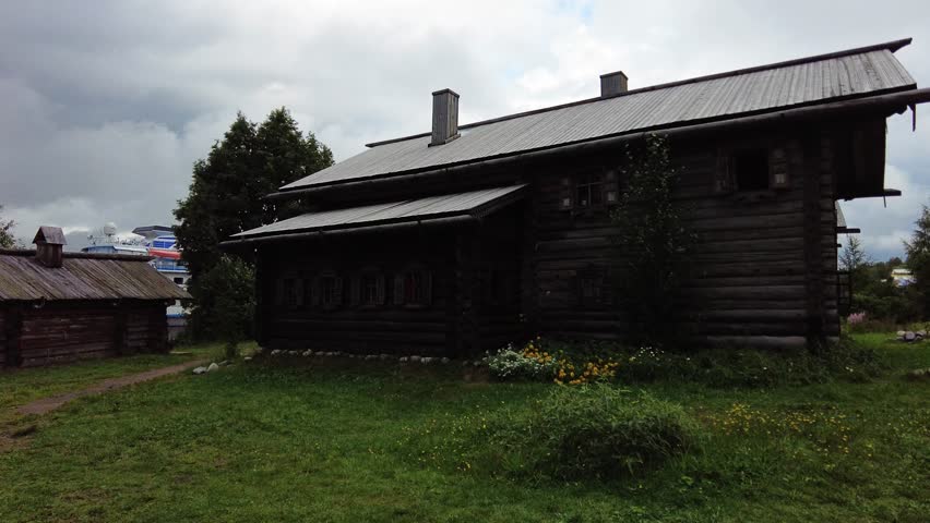 Old wooden house in a Russian village. Construction made of logs. Shot in 4K (ultra-high definition (UHD)), so you can easily crop, rotate and zoom, without losing quality! Real time.