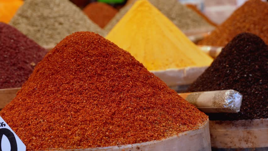 Arabic Spices in Market . Selective blurring on piles of spices of different colors and flavors used in Turkish cuisine in Istanbul Egyptian spice market, called Misir Carsisi, in Turkey.