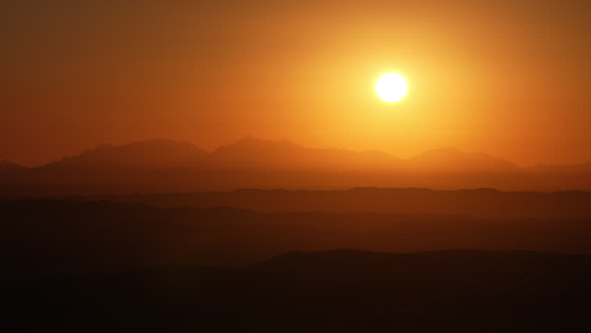 California monochromatic sunrise with gradients over mountains and desert sand dunes