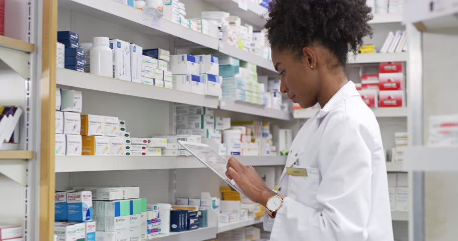 Pharmacist, woman and tablet by shelf for medicine research, stock inventory and planning medical sales or profit. Pharmacy doctor with pills bottle, drugs and digital technology for retail checklist