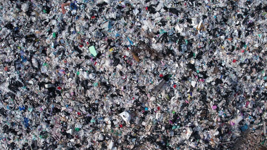 Aerial view, piles of garbage, plastic bottles and garbage. waste sorting facility Concept of waste disposal and waste separation to preserve the environment and save the world. Royalty-Free Stock Footage #1110955343