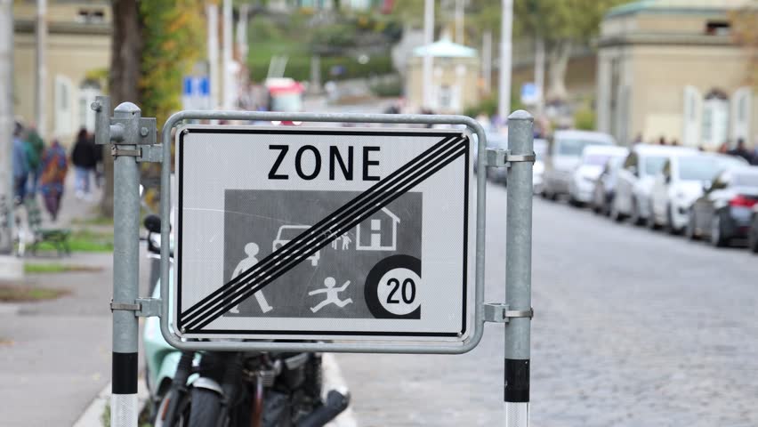 End of pedestrian zone road sign, establishing shot blurred background