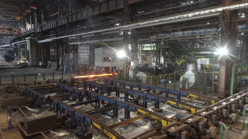 Red hot metal in a modern factory slow motion. Metal production process in a metallurgical factory. Modern metallurgical factory | Shutterstock HD Video #1110965169