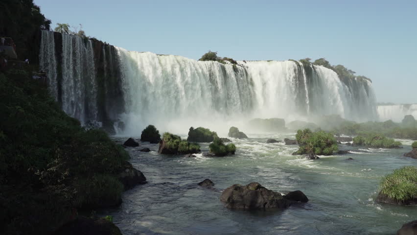 The Iguazu Falls are located at the border between Brazil and Argentina and are one of the seven wonders of the world, a populat ravel destination in the rainforest of south America. Royalty-Free Stock Footage #1110966701