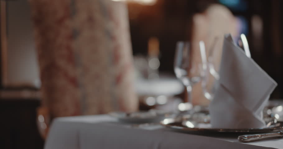 Woman carefully setting an upscale table Royalty-Free Stock Footage #1110969391