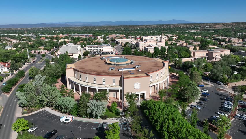 New Mexico state capitol building. Aerial orbit around round government building in downtown Santa Fe, NM.
