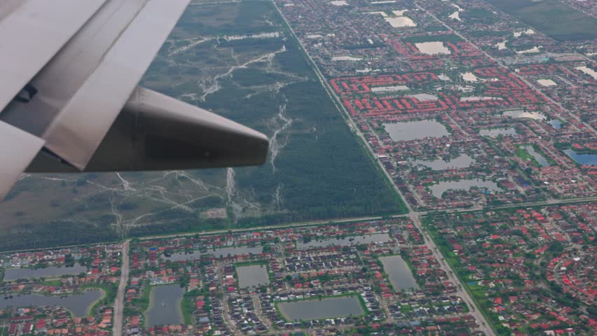 Beautiful view from airplane window during landing at Miami Airport, offering glimpse of natural surroundings of city of Miami. USA. | Shutterstock HD Video #1110987107