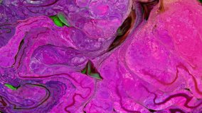 This stock video shows what happens when milk is introduced to a mixed-color paint. The colors swirl and form new shades of paint slowly flowing into a marbled mix. 