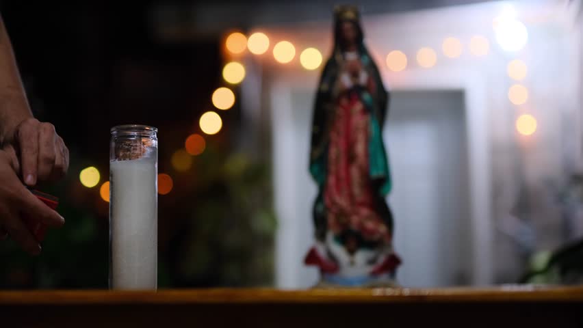 hands of a man lighting candle for Virgin of Guadalupe. Mexican catholic tradition Royalty-Free Stock Footage #1110990787
