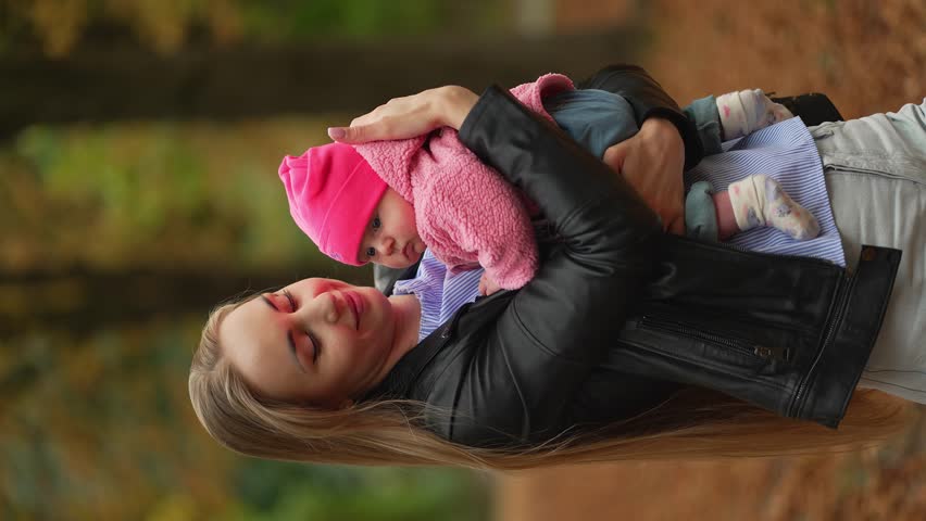 Young mother holding her tiny baby