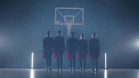 Performance, team of woman basketball players walks in a contour lighting, the international women's basketball championship, stance in front of the camera, anonymous personalities. - Powered by Shutterstock - Get 15% off with code: PIKWIZARD15