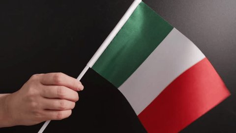 hand waving a flag of Italy on the background of a school board, foreign italian language school, education and training, online courses  – Video có sẵn