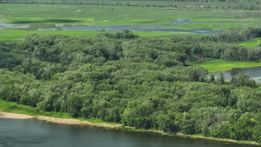 Aerial View Of Speedboat In The Mississippi River Along The Great River Bluffs State Park In Minnesota, USA - drone shot