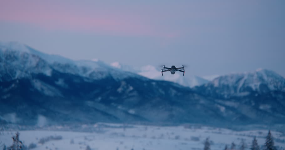 Prosumer drone flying towards beautiful Tatra mountain range on a Poland and Slovakia border before sunrise | Shutterstock HD Video #1111022855