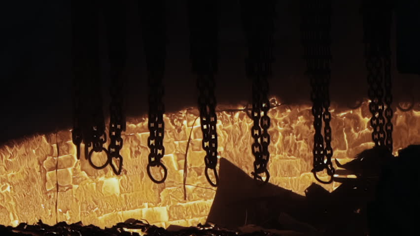 Huge Loading Crane of Scrapping Metal Unloads the Steel Scrap to the Furnace to Melt. High temperature. Dangerous Manufacture. Sparks at Dark Background. Metal Production. Foundry. Slow Motion. | Shutterstock HD Video #1111024429