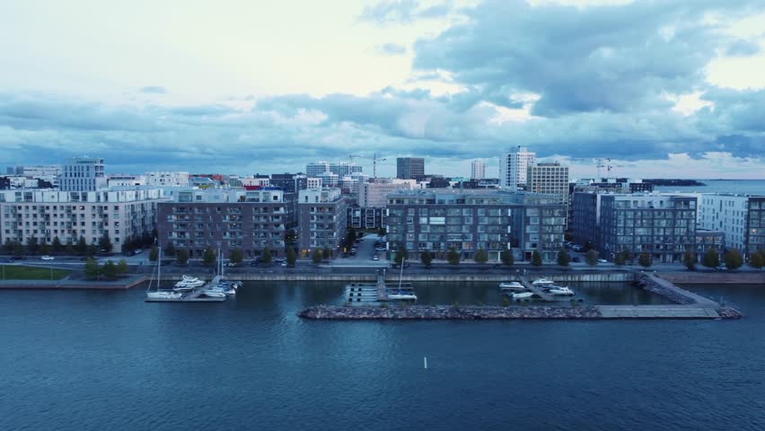 Aerial dolly along small marina on Baltic Sea waterfront in Helsinki