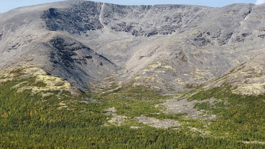Autumn Arctic landscape in the Khibiny mountains. Kirovsk, Kola Peninsula, Polar Russia. Autumn colorful forest in the Arctic, Mountain hikes and adventures. 4K