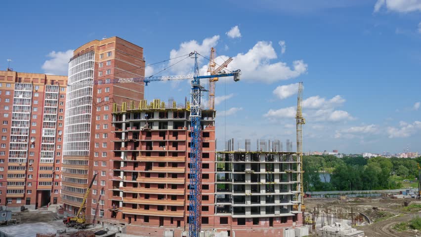 Novosibirsk  Russia - August 21 2018
The construction of multi-storey houses of brick, the builders working on large construction. Time laps
Construction industry and engineering.