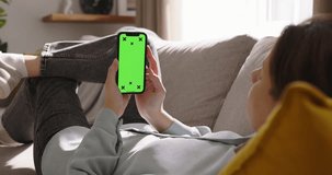 Unknown woman holds smartphone chroma key tracking points mockup. Advertisement app social media, online shopping. Tap at bottom of screen, buy online, submit an application, interact with phone app