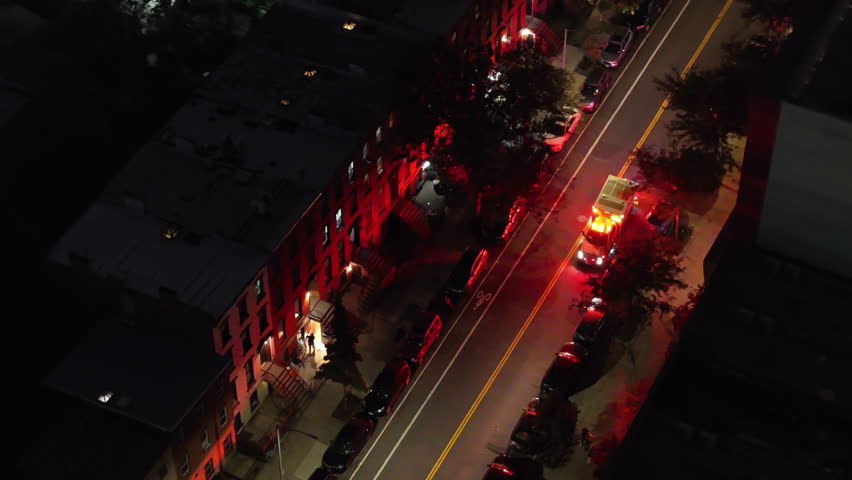 Aerial view of an ambulance on a Brooklyn street at night