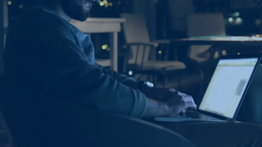 Animation of network of connections with icons over caucasian businessman using laptop. Global business, computing, networks, digital interface and data processing concept digitally generated video.