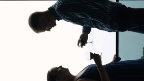 Vertical video. Young couple clinking glasses of wine on a terrace of hotel, slow motion. Beautiful sea view is on the background - Powered by Shutterstock - Get 15% off with code: PIKWIZARD15