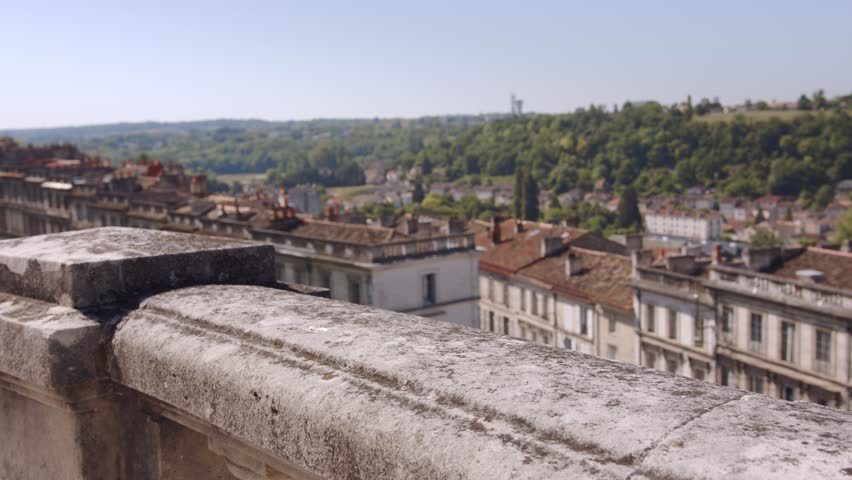 Female Tourist Looking And Appreciating The Historic Buildings In Angouleme, France - medium