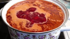Borscht is cooked in a saucepan on the stove. Close-up. Slowmotion video. Home cooking. Cooking master class. Step-by-step video recipe for making borscht.
