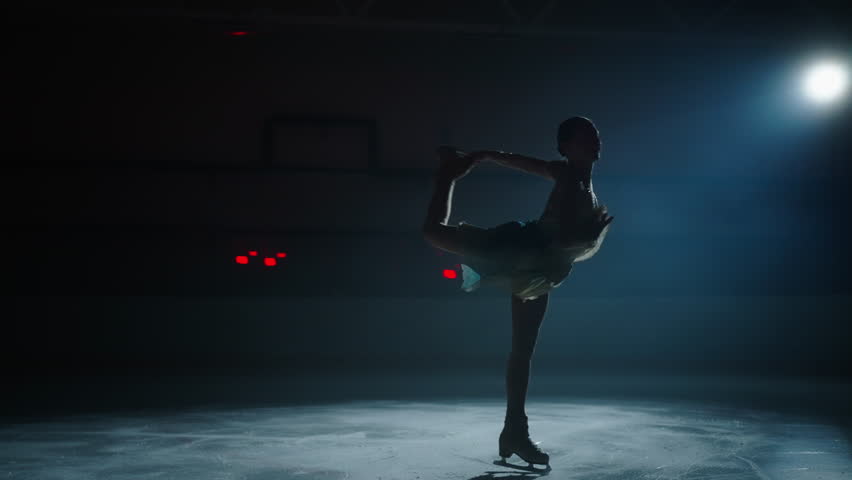 Graceful Woman Spinning On Ice In Darkness, Silhouette Slow Motion Shot, Future Champion Royalty-Free Stock Footage #1111043869