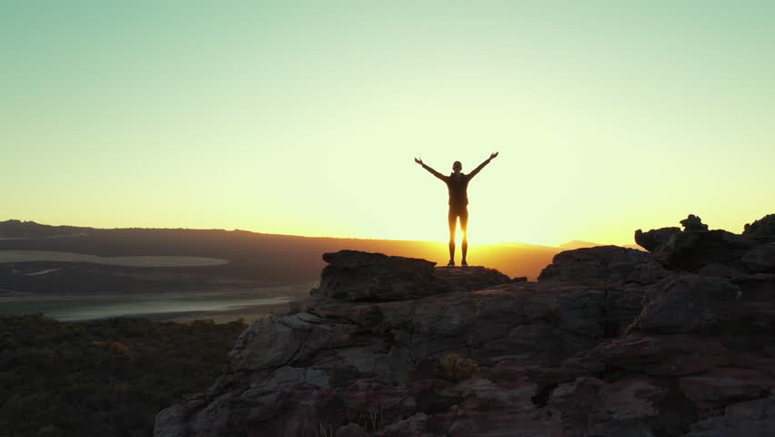 Sunset, silhouette person and yoga meditation for wellness, mindfulness or channel nature aura, soul or chakra energy healing. Cliff, forest view or back of pilates yogi meditate for relax self care