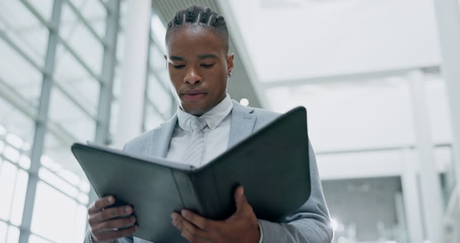 Justice, elevator and a black man lawyer reading a case file while in an office in preparation of a trial. Legal, law and documents with a male attorney looking at research, information or evidence Royalty-Free Stock Footage #1111048375