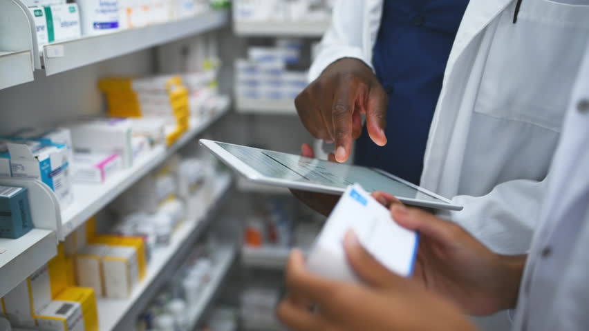 People, hands and pharmacist with tablet, box or medication on shelf for inventory inspection or dispensary. Closeup of medical team with technology checking pharmaceutical stock or drugs at pharmacy - Powered by Shutterstock - Get 15% off with code: PIKWIZARD15
