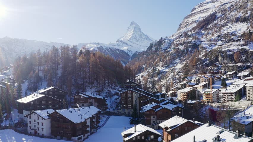 Drone Shot of Zermatt, Switzerland, Snow Capped Town Building in Valley Under Matterhorn Mountain, Alps