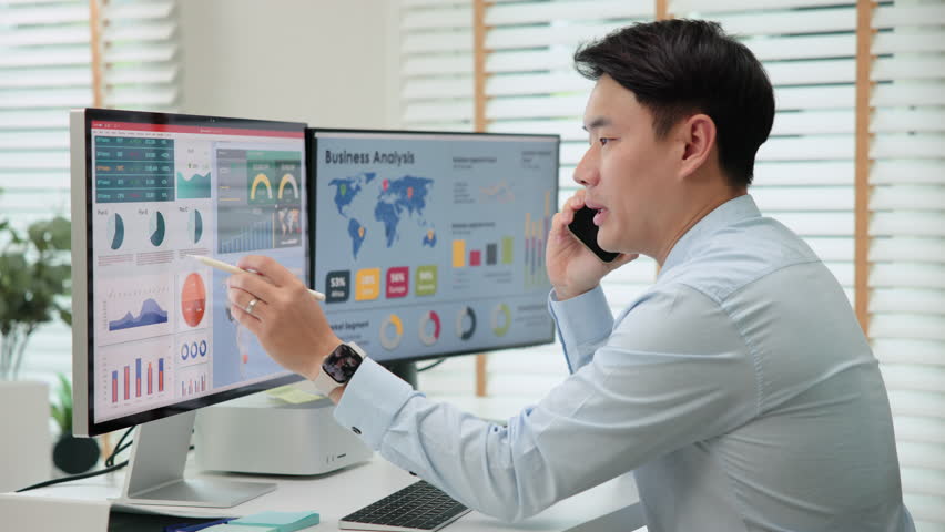 Asia people tech expert man phone call talking working on IT project predict sales SEO graph chart AI plan visual big data science report center BI smart tools screen. Office chinese asian analyst job Royalty-Free Stock Footage #1111054939