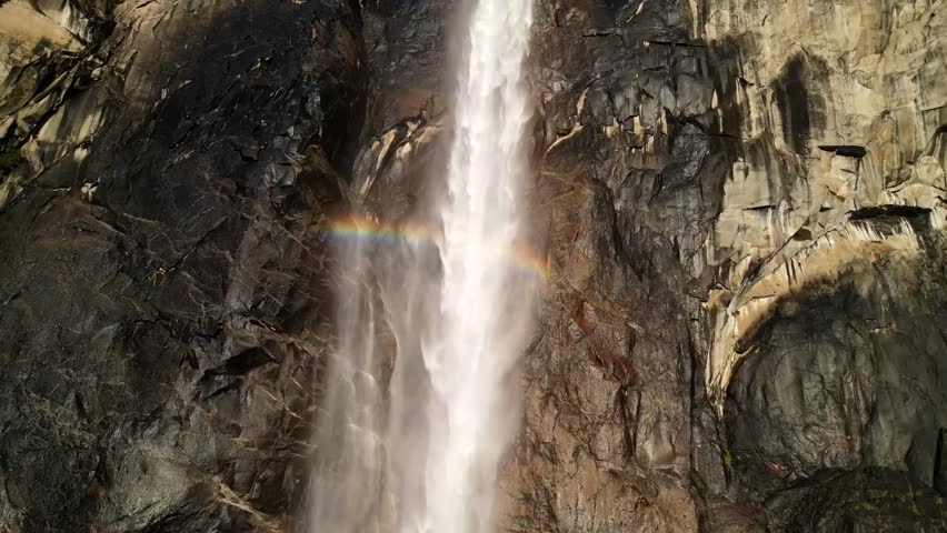 A cinematic drone shot that zooms in on Bridalveil Falls in Yosemite National Park.