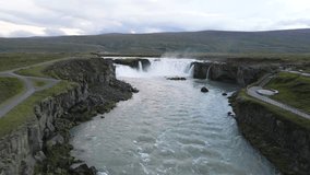 Explore Iceland with 4K drone footage of Goðafoss Waterfall. Perfect for travel, nature-themed content, and cinematic shots. The footage is captured in Iceland in the Summer a great shot of Goðafoss.