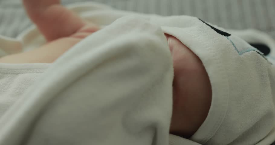 Happy little newborn boy lies in a bath towel Royalty-Free Stock Footage #1111063463