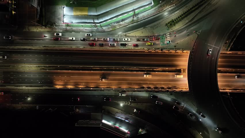 Time lapse expressway top view, drone aerial zoom out,  Circl Road traffic an important infrastructure in Bangkok Thailand, 4K, energy power Royalty-Free Stock Footage #1111069945