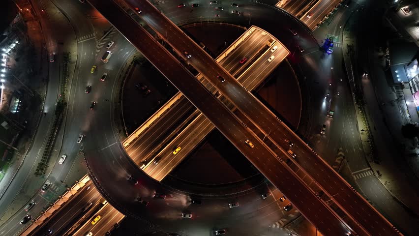 Time lapse expressway top view, drone aerial zoom out,  Circl Road traffic an important infrastructure in Bangkok Thailand, 4K, energy power Royalty-Free Stock Footage #1111069949