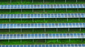 A solar power installation reveals meticulous alignment of photovoltaic modules, efficiently converting sunlight into clean electricity. Eco-friendly energy: Renewables light the way. Drone view.
