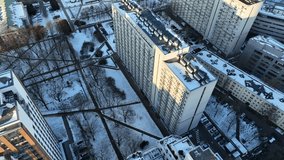 View of a large communist block full of apartments.
Video footage of apartment block.